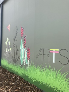 Part of the side of the Northstowe temporary community centre. The building features artwork inspired by nature and designed with input from residents.