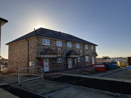 New Council homes under construction in Cottenham. The building work is almost completed - however some construction materials remain in-place in the photo.