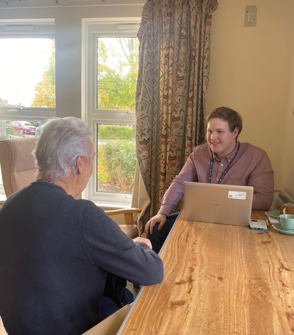 Tim Macey officer advises a residnet on benefits they can claim