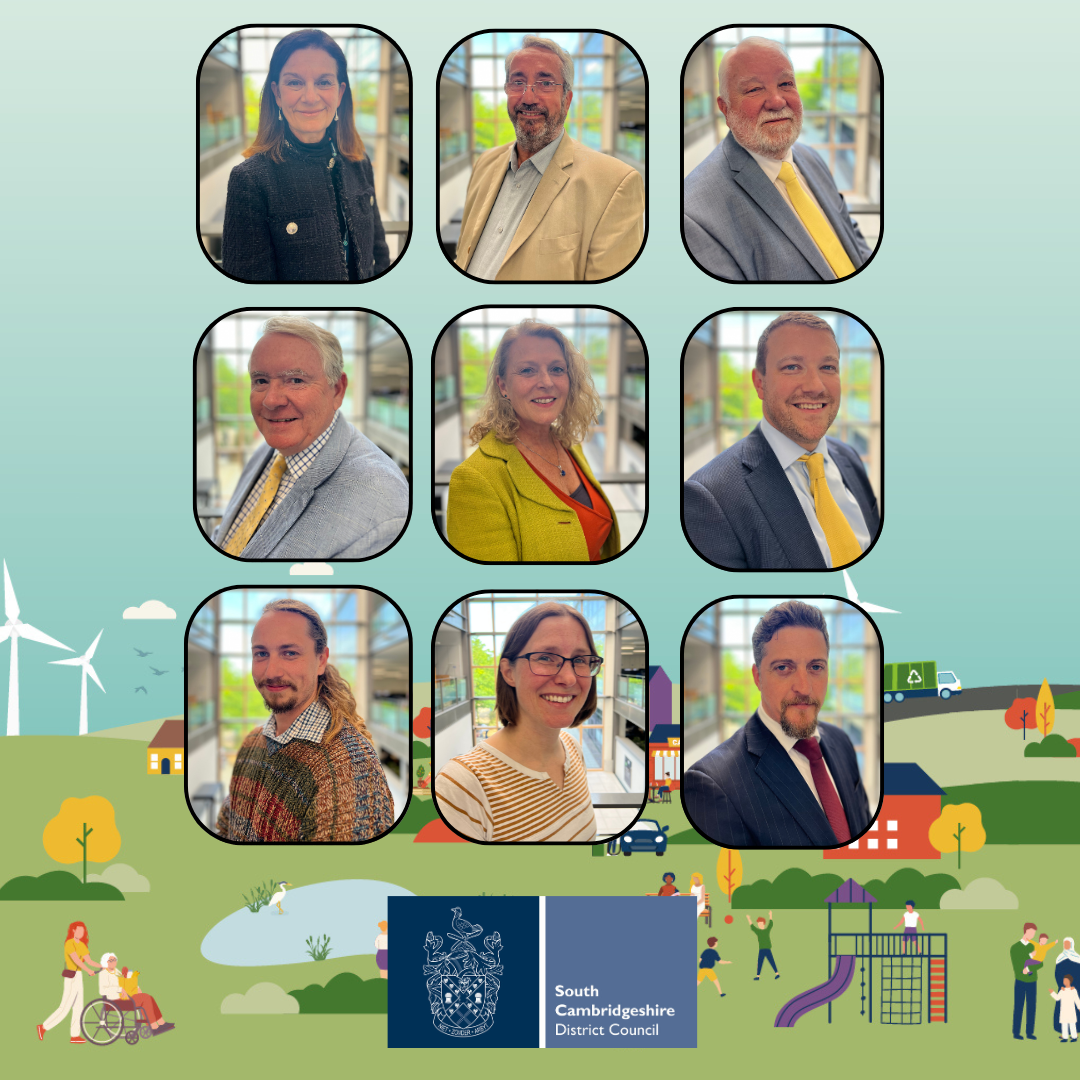 Portrait collage of nine council representatives arranged in a three‑by‑three grid with rounded frames, photographed indoors against a bright window backdrop. The image sits above an illustrated landscape showing homes, trees, a wind turbine, a recycling lorry, a playground and people in a community setting. At the bottom is the South Cambridgeshire District Council logo and name
